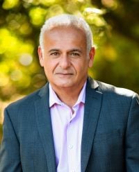 Professional headshot of Arash Bahman.
