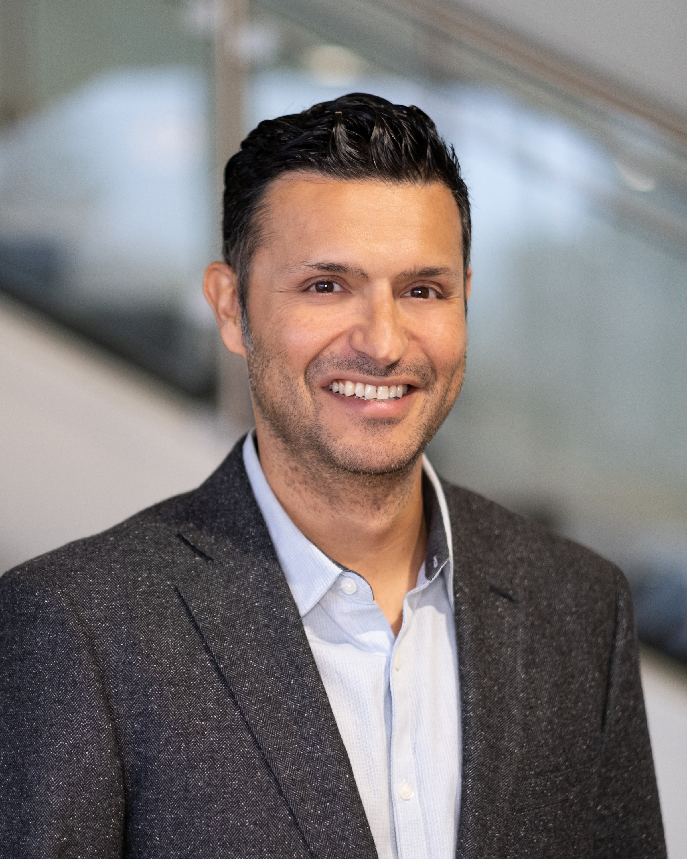 Professional headshot of Yusuf Haschemi.