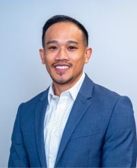 headshot of Reggie Ouk.