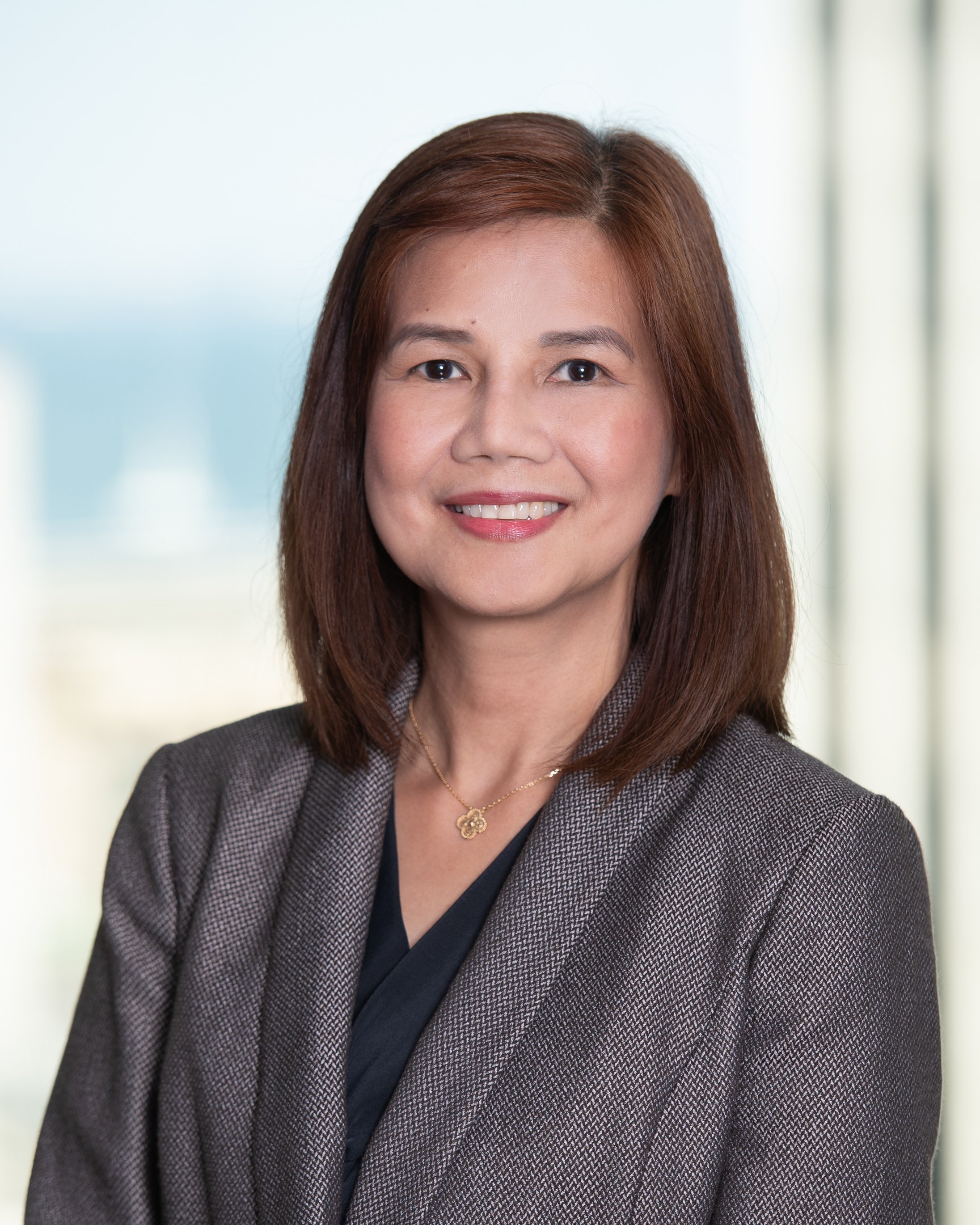 Professional headshot of Sheryl Ocampo.